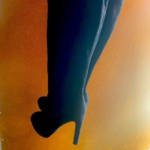 Black knee high heel boots, size 6.
